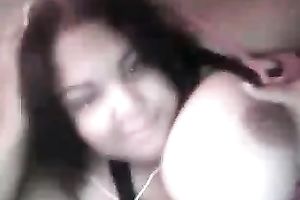 Cute black skin dark brown playgirl shows off her heavy boobies