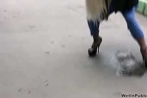 Kate makes a puddle in the street and changes her garments