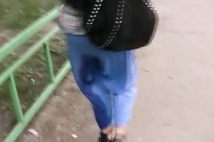 Kate makes a puddle in the street and changes her garments