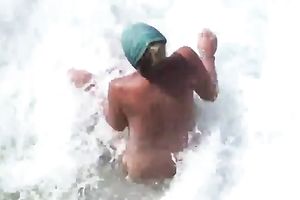 Slutty woman is giving her hubby a ideal tugjob on the beach