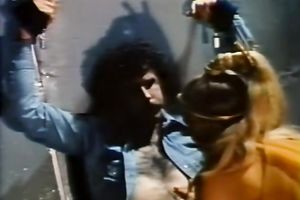 Seductive dark brown in a golden outfit puts on a show.