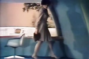 Seductive dark brown in a golden outfit puts on a show.