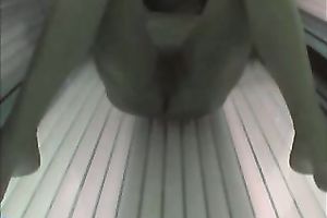 Hot blonde temptress tans her charming body in solarium