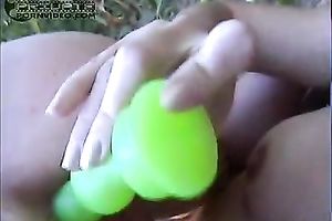 Two lusty Slavic legal age teenagers in the bushes play with fancy sex toys