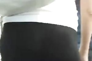 Amateur chick wearing taut legging doesn't know I am filming her