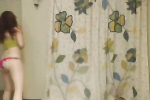 Webcam solo with redhead hussy stripping and oiling her body