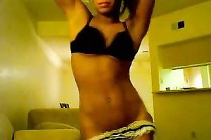 Ebony legal age teenager with consummate body undresses in front of a livecam