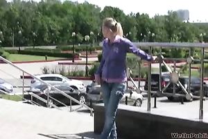 Irina changes her raiment behind the corner after peeing her panties