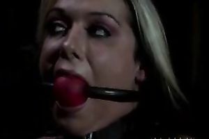 Sexy blond wife with a ball gag in face hole is tortured in the darkness