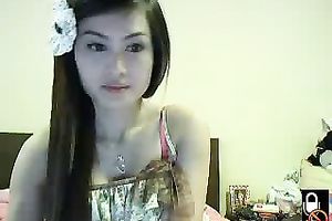 Lovely Asian dark brown legal age teenager on cam shows her small ass