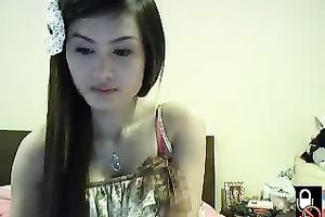 Lovely Asian dark brown legal age teenager on cam shows her small ass