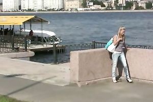 Sensual golden-haired Olga pees her panties on the embankment