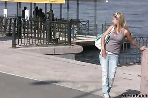 Sensual golden-haired Olga pees her panties on the embankment