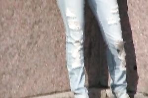 Sensual golden-haired Olga pees her panties on the embankment