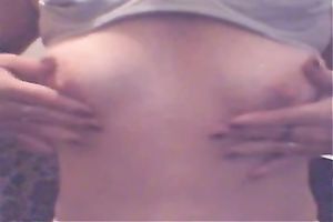 Skinny white floozy plays with her miniature breasts and her soaked vagina