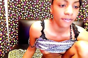 Amateur ebon cam model on the leather daybed masturbating