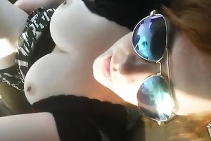 Big natural busty wife goddess inserts a phallic like object inside her vagina in the car