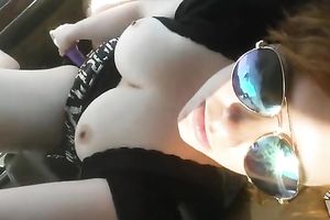 Big natural busty wife goddess inserts a phallic like object inside her vagina in the car