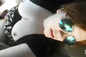 Big natural busty wife goddess inserts a phallic like object inside her vagina in the car