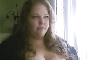 Charming big beautiful woman deepthroats a sex toy in a sexy intimate web camera show