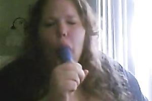 Charming big beautiful woman deepthroats a sex toy in a sexy intimate web camera show