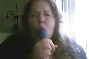 Charming big beautiful woman deepthroats a sex toy in a sexy intimate web camera show