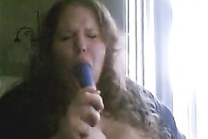 Charming big beautiful woman deepthroats a sex toy in a sexy intimate web camera show
