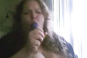 Charming big beautiful woman deepthroats a sex toy in a sexy intimate web camera show