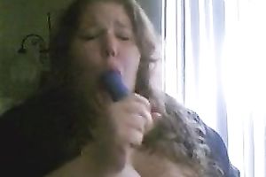 Charming big beautiful woman deepthroats a sex toy in a sexy intimate web camera show