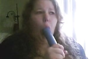 Charming big beautiful woman deepthroats a sex toy in a sexy intimate web camera show