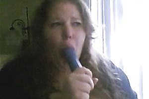Charming big beautiful woman deepthroats a sex toy in a sexy intimate web camera show