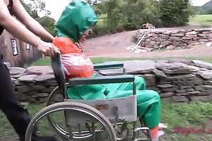 Lascivious nympho is placed into a wheeled restraint chair