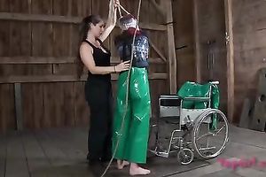 Lascivious nympho is placed into a wheeled restraint chair