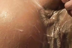 Girlfriend oils up and lubricates her white soaked bum