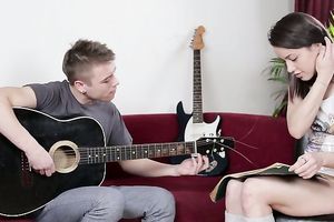 Raven haired legal age teenager seduces below sounds of guitar for some anal