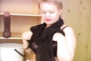 Chubby short-haired milf disrobes and pees in a bucket