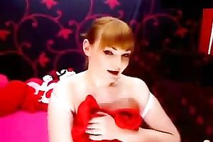 Amateur redhead plays with her enormous bumpers in webcam show