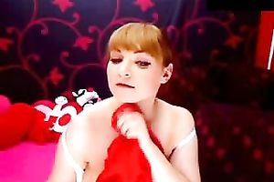 Amateur redhead plays with her enormous bumpers in webcam show