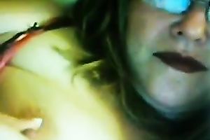 Lewd fair-haired milf licks her big jugs in front of a livecam