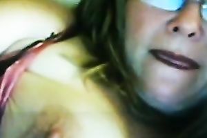 Lewd fair-haired milf licks her big jugs in front of a livecam