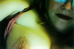 Lewd fair-haired milf licks her big jugs in front of a livecam