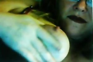 Lewd fair-haired milf licks her big jugs in front of a livecam