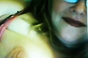 Lewd fair-haired milf licks her big jugs in front of a livecam