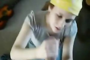 Pretty nympho is engulfing my large wet pecker on her knees