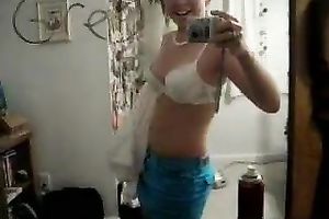 Solo scene with a naughty legal age teenager stripping in front of a mirror