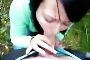 Raven haired wench is engulfing and jerking off my dick in front of a camera