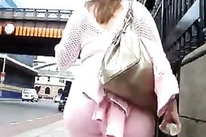 Massive and hot wazoo of golden-haired playgirl wearing pink taut trousers walk down the street