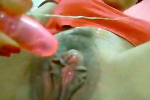 Her tiny and pink marital-device permeating her fur pie and vibrating to please her