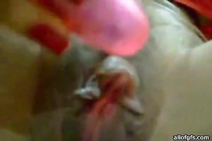 Her tiny and pink marital-device permeating her fur pie and vibrating to please her