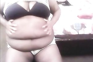 Plump bitch with large whoppers is rubbing her bulky abdomen for her online viewers